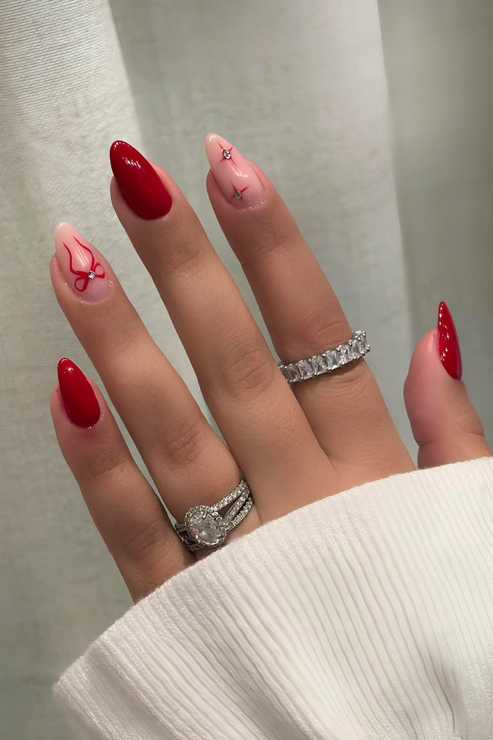 Dual-tone red French tips on almond nails, Pinterest modern nails.