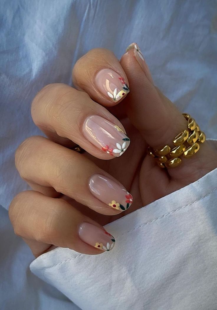 Floral French tips on short square nails.
