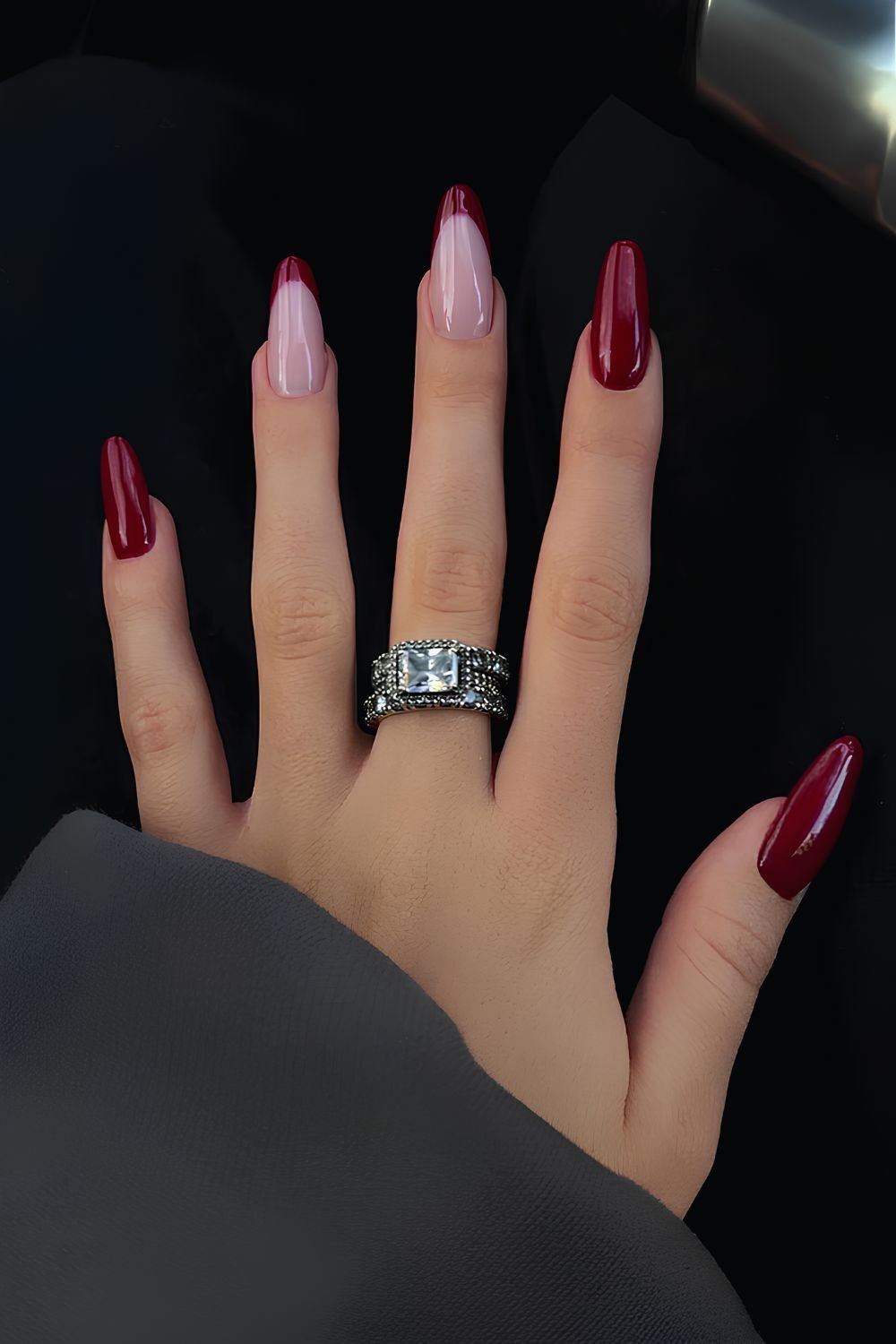 Deep red French tips on long square nails.