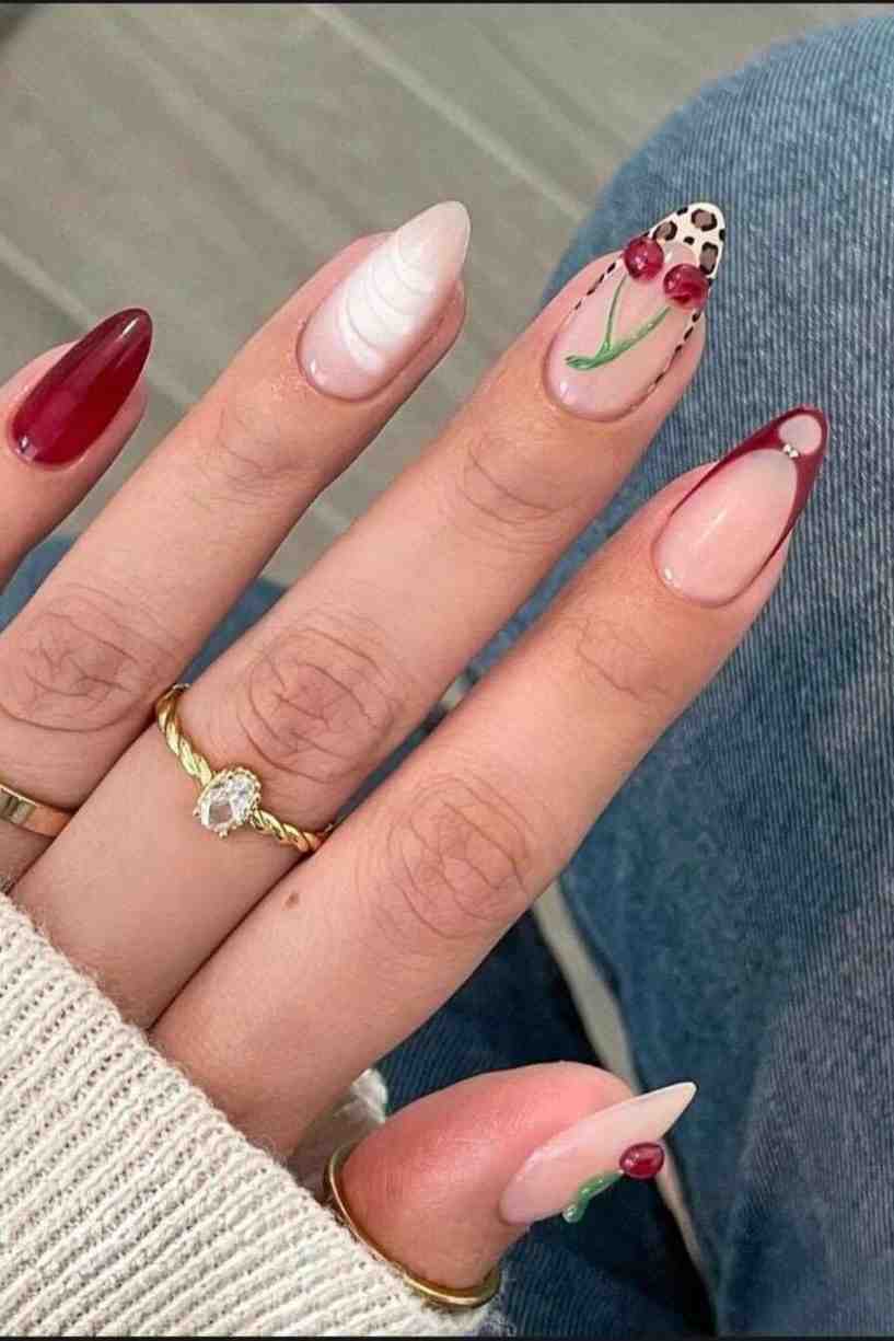 Playful cherry accents with nude base and almond shape