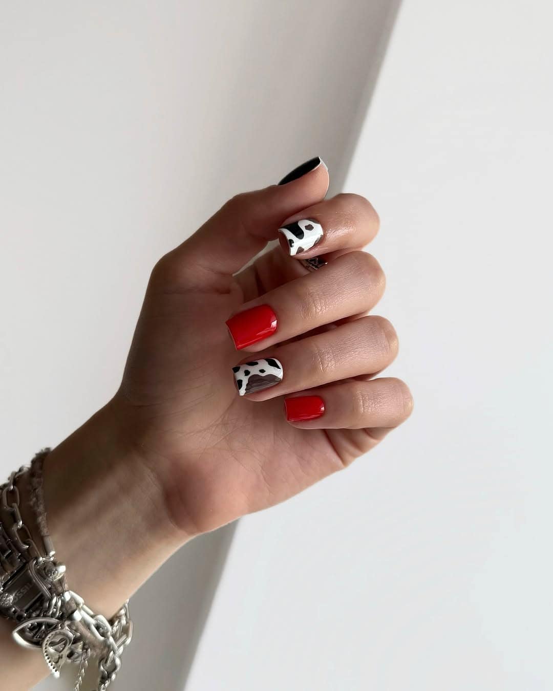 Red nails with black and white accents