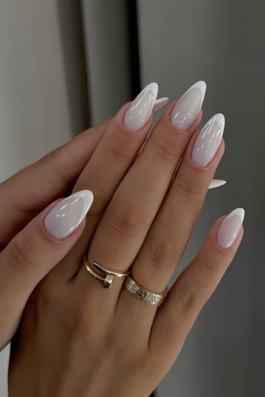 Classic French nails with almond shape, glossy finish