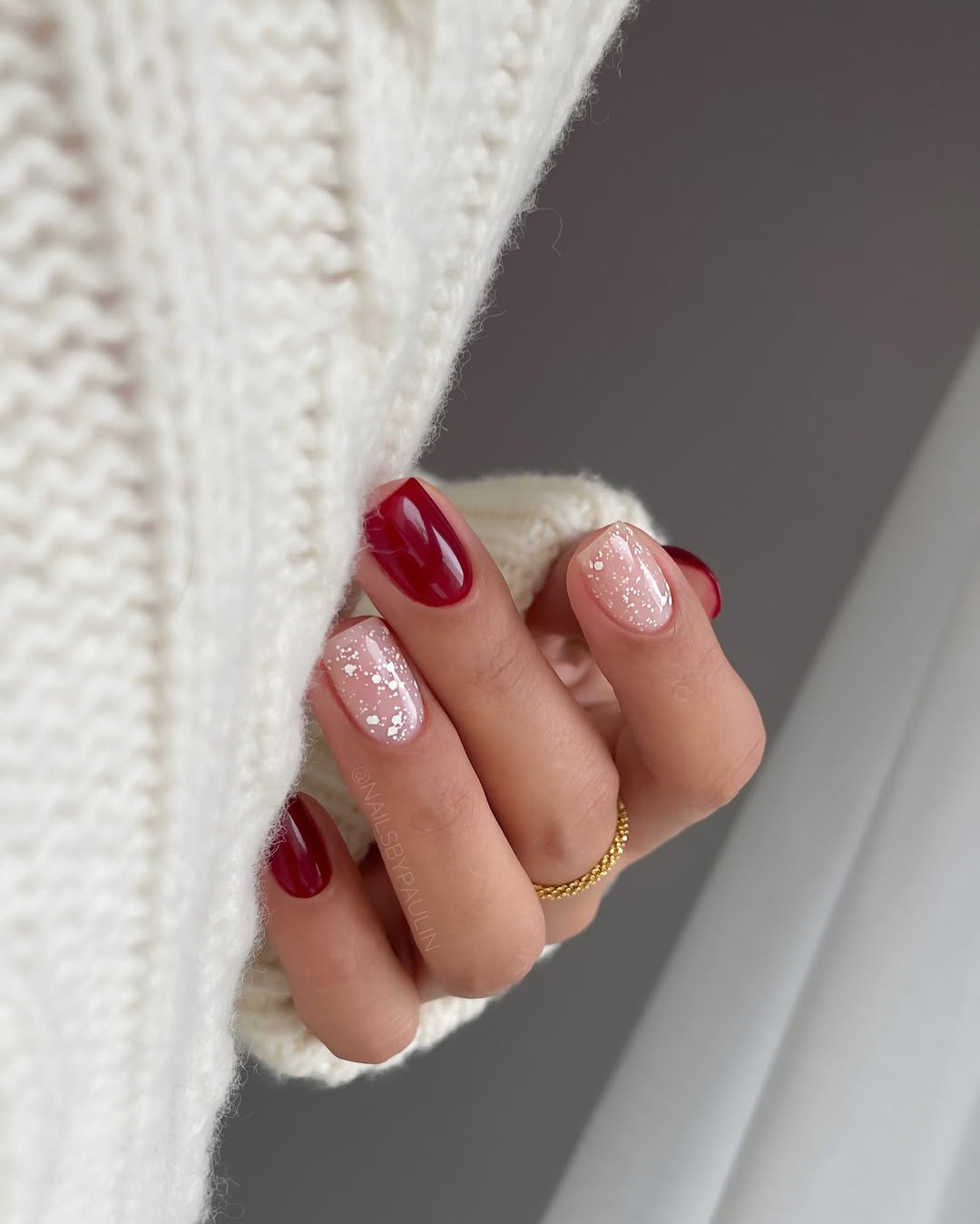 Red nails with glitter accents, short length