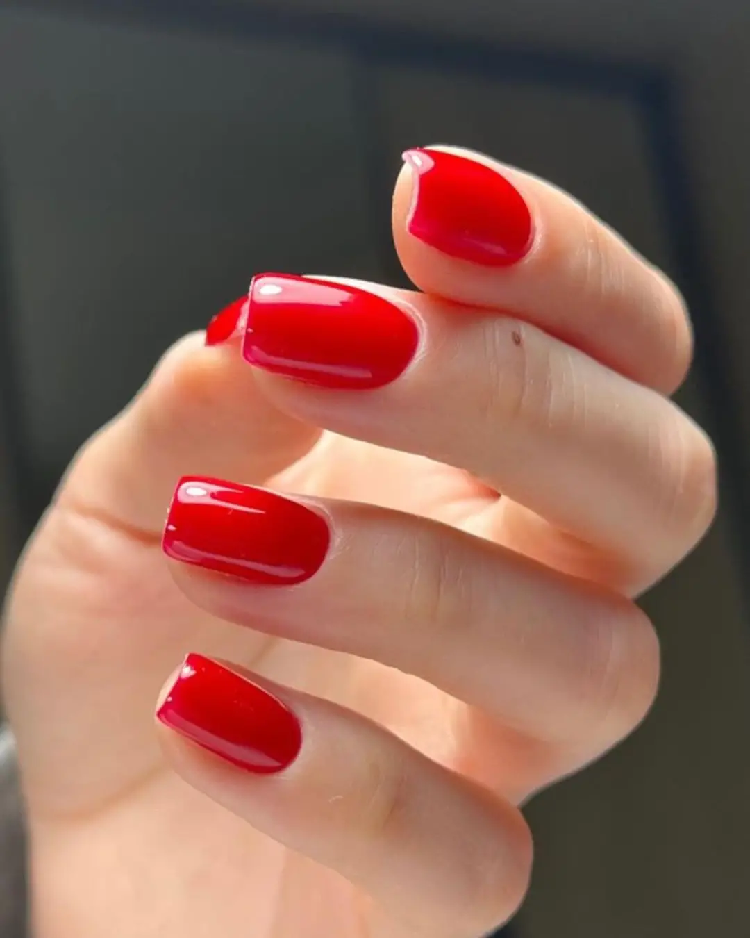 Bright red nails, short square shape