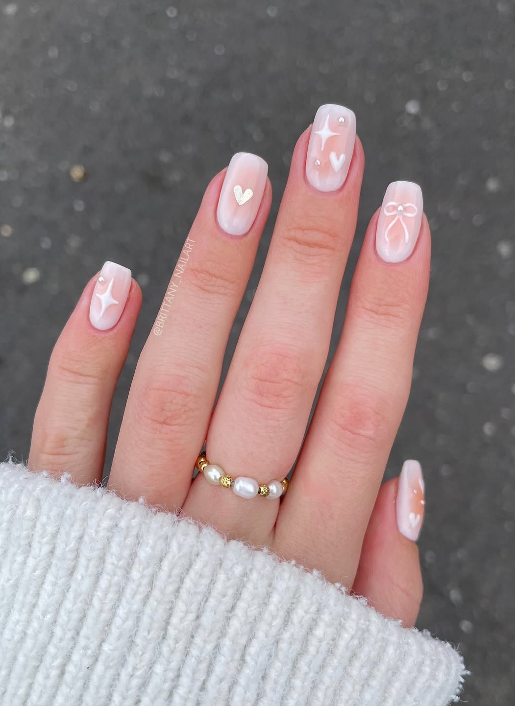 Soft pink nails with heart accents, Pinterest nail art.
