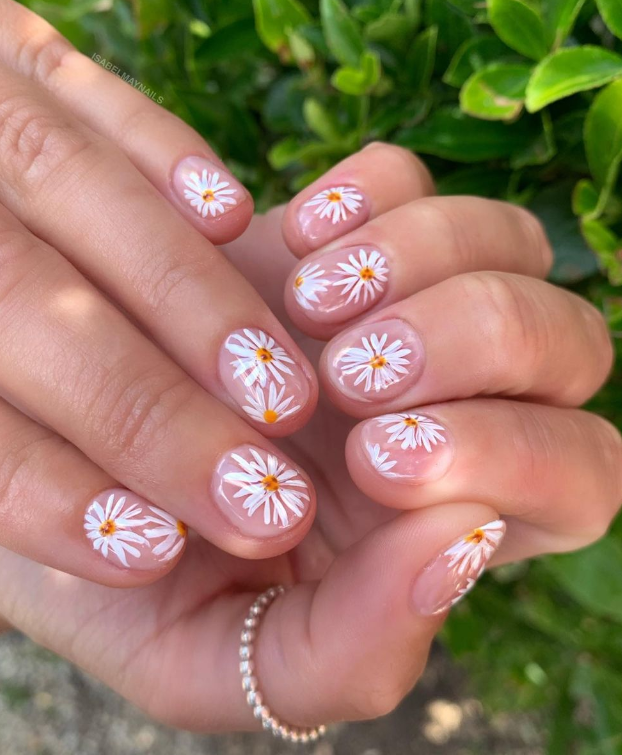 Daisy nail art on natural base, Pinterest floral nails.