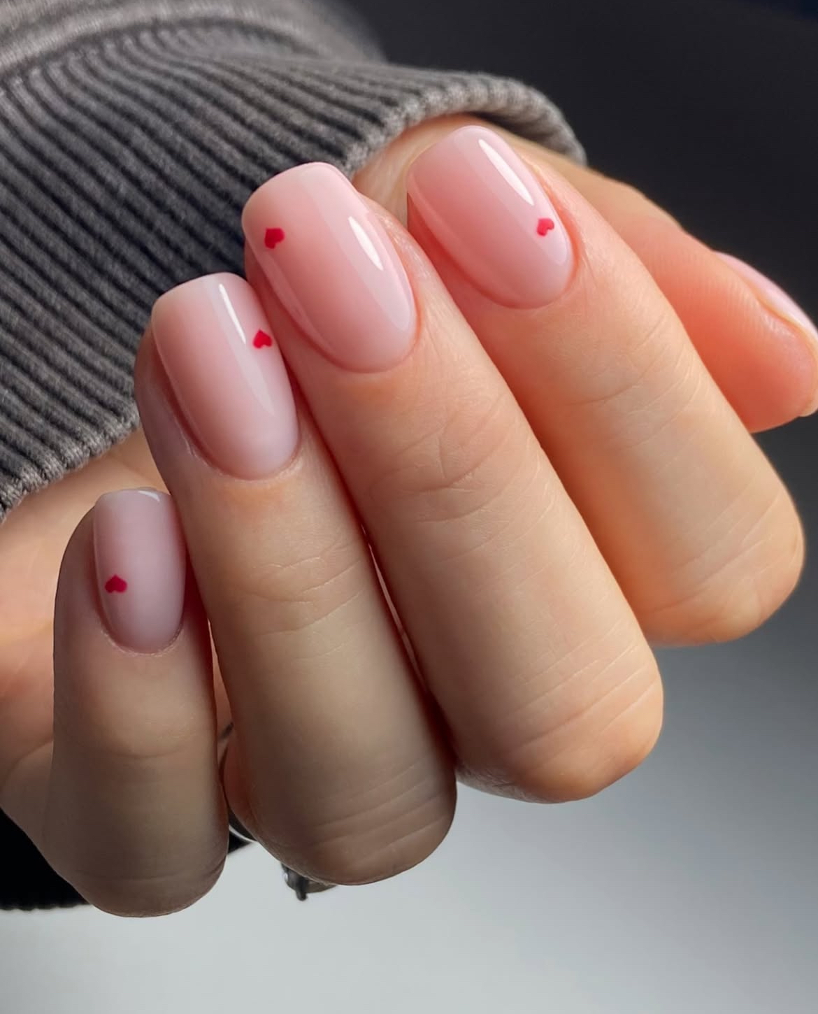 Pink nails with heart accents, Pinterest romantic nail art.