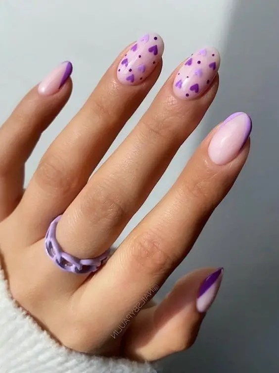 Purple nails with heart details, Pinterest fun nail art.