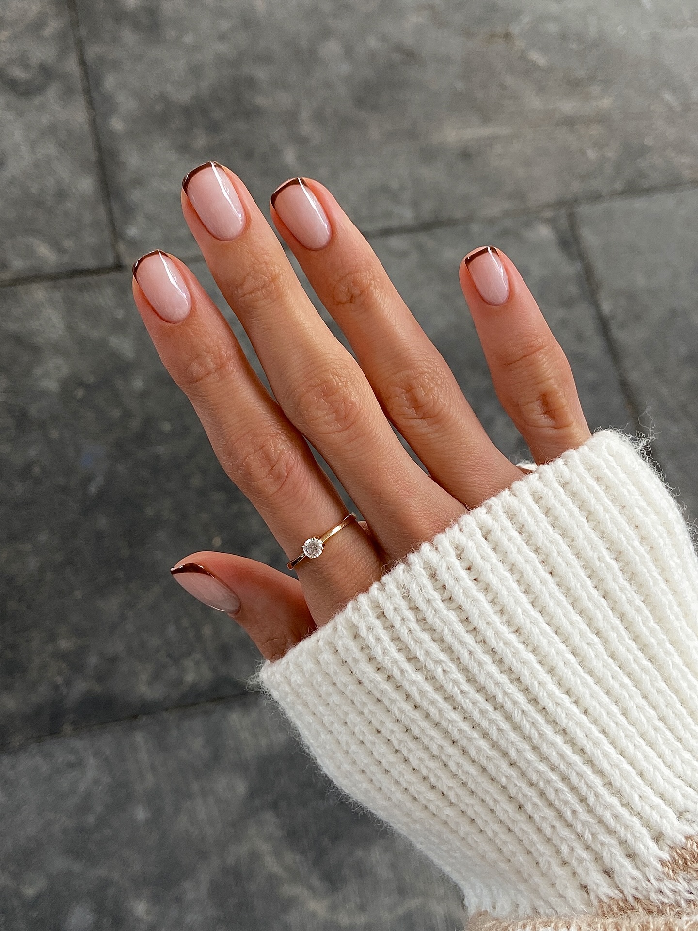 Minimalist black tips on short square nails, sleek look