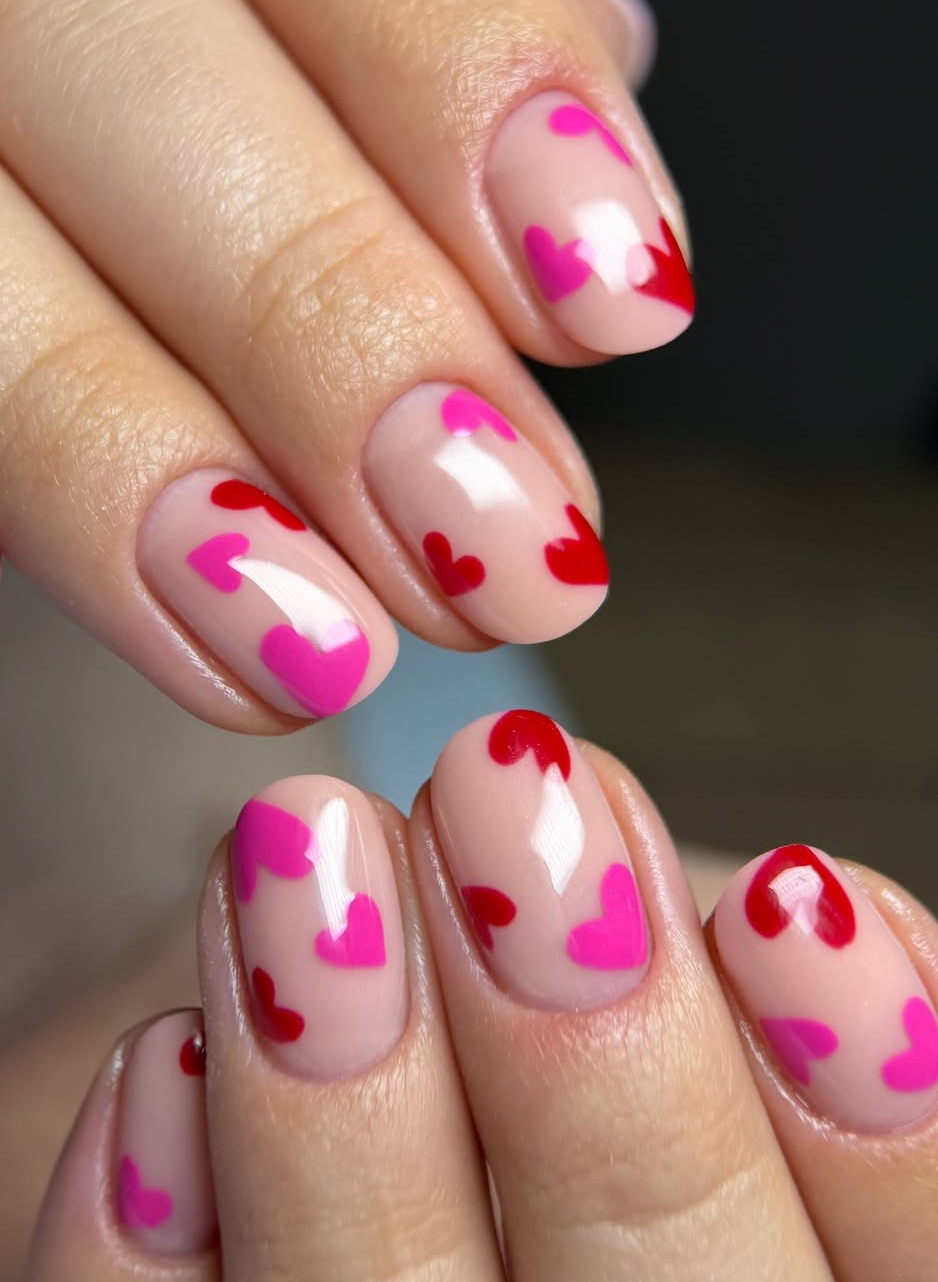 Pink and red heart nails, short oval shape, romantic style