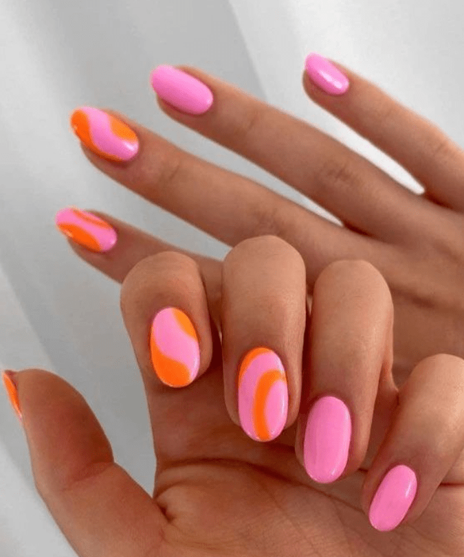 Pink and orange swirl nails, short almond shape