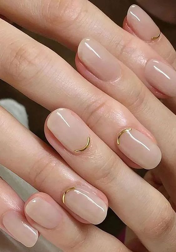 Nude nails with gold crescent, short square shape