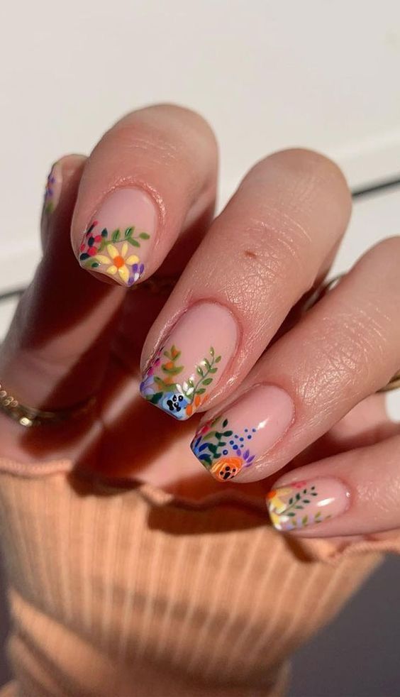 Floral nail art on short square nails, colorful design