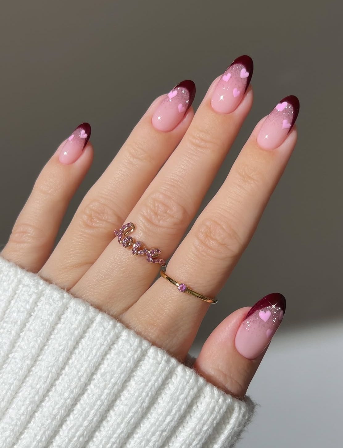 Maroon and pink heart nails, almond shape, romantic design