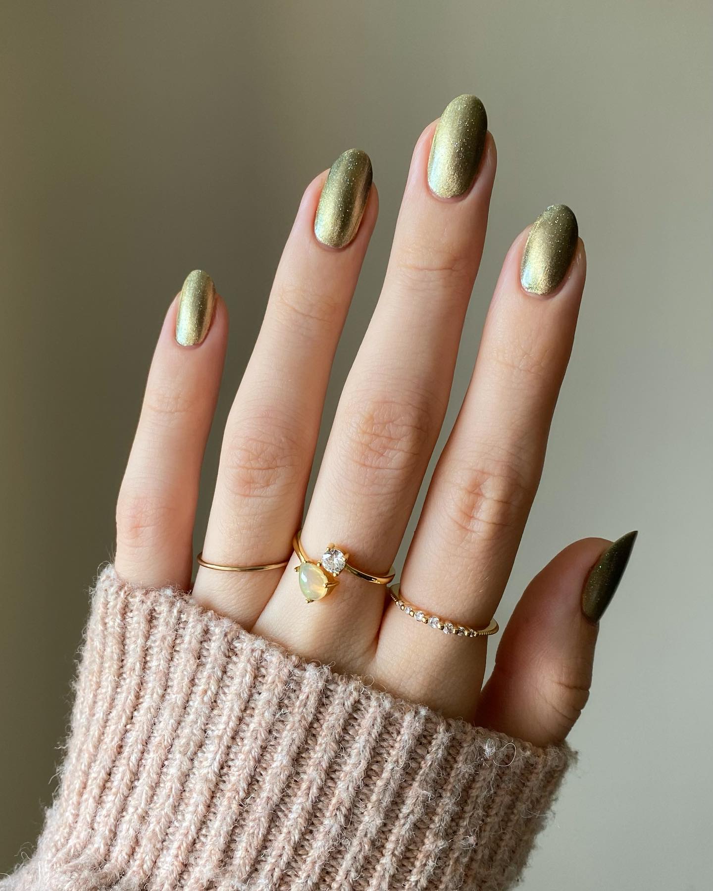 Short almond nails with metallic gold finish