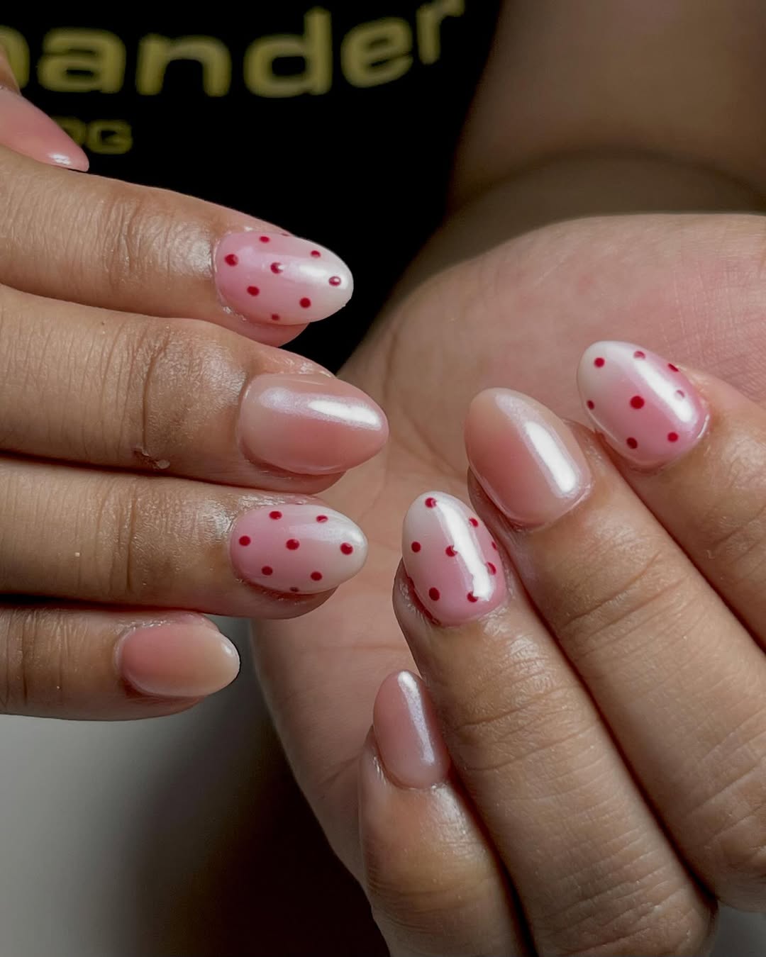 Short almond nails with red polka dots