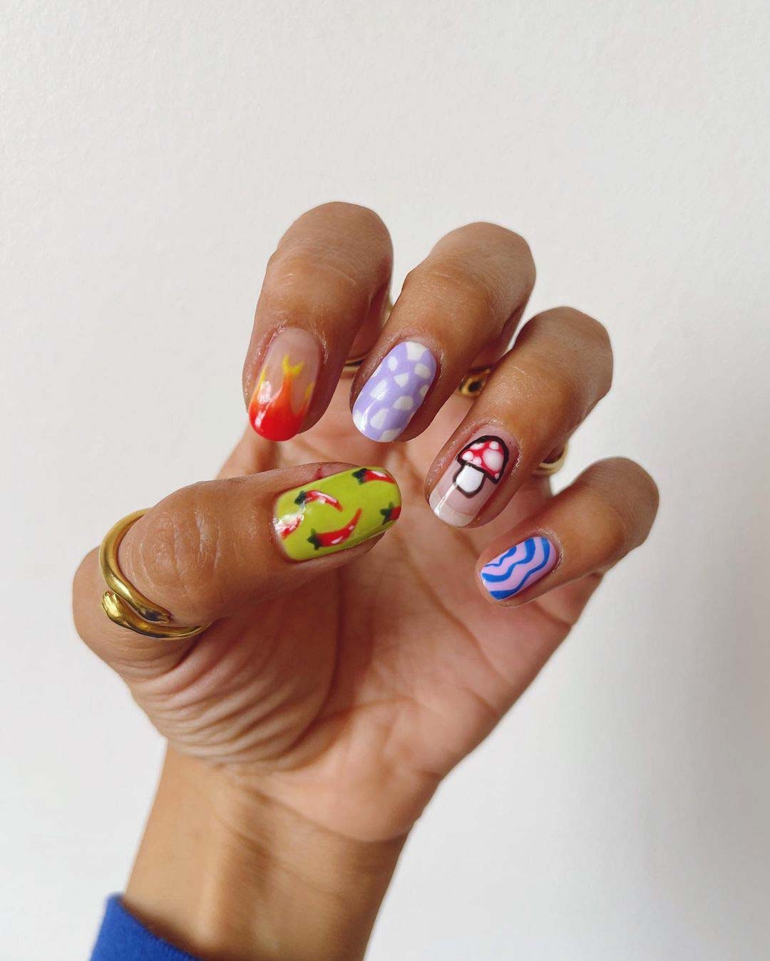 Short oval nails with colorful abstract nail art