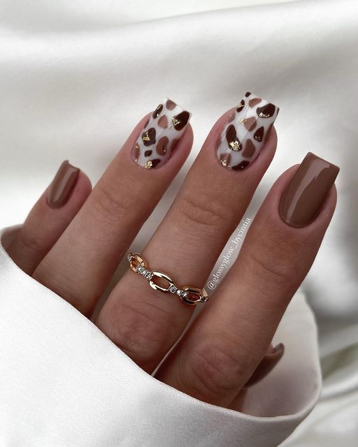 Short square nails with animal print and brown polish