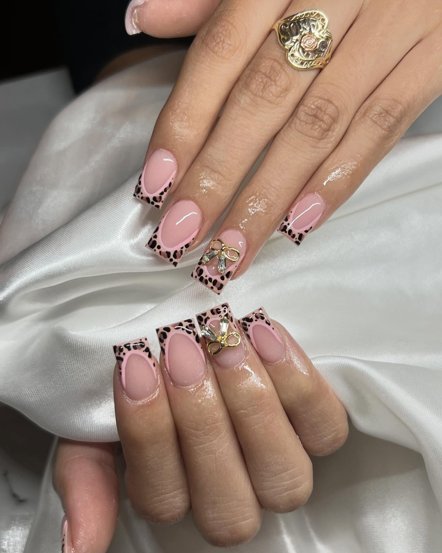 Short square nails with leopard French tips and pink base