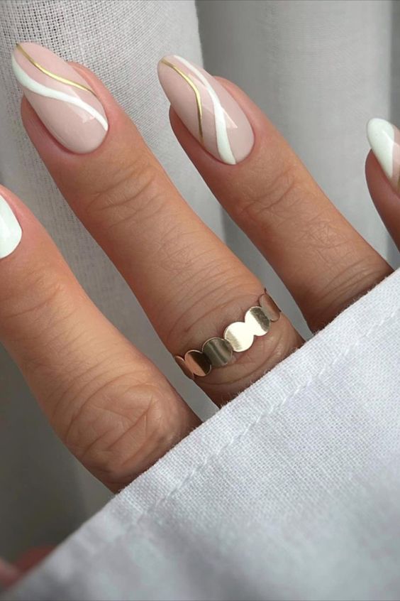 Short almond nails with white and gold stripe nail art