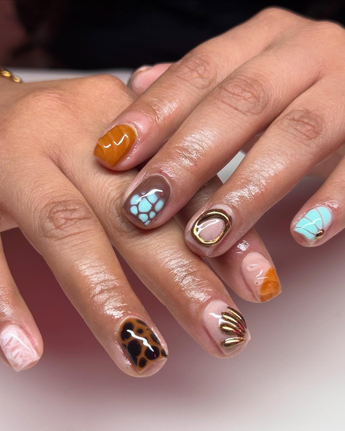 Mixed pattern and texture nails with vibrant colors, artistic expression, Pinterest creative nails.