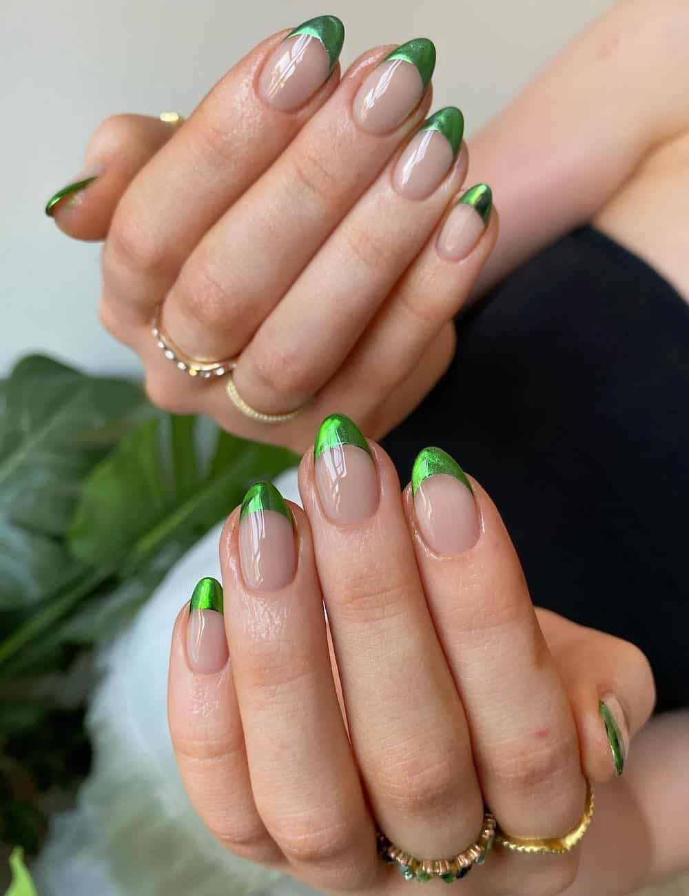 Metallic green French tips on natural base, modern chic, Pinterest elegant nails.
