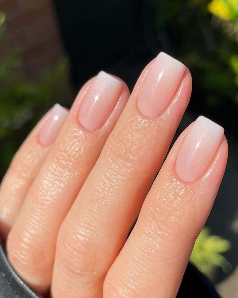 Soft ombre French nails, natural elegance, everyday chic.