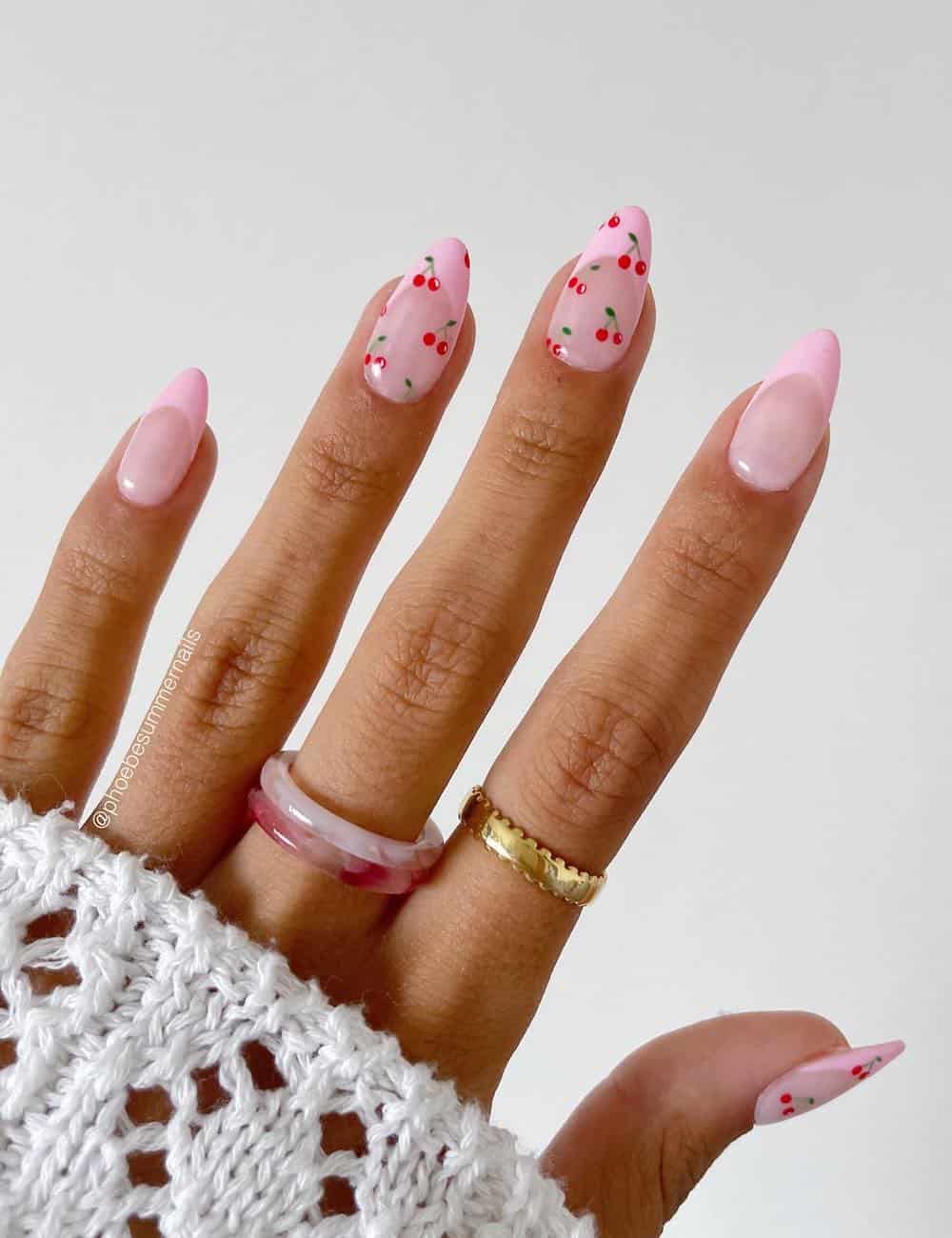 Pink nails with confetti dots, playful and fun design.