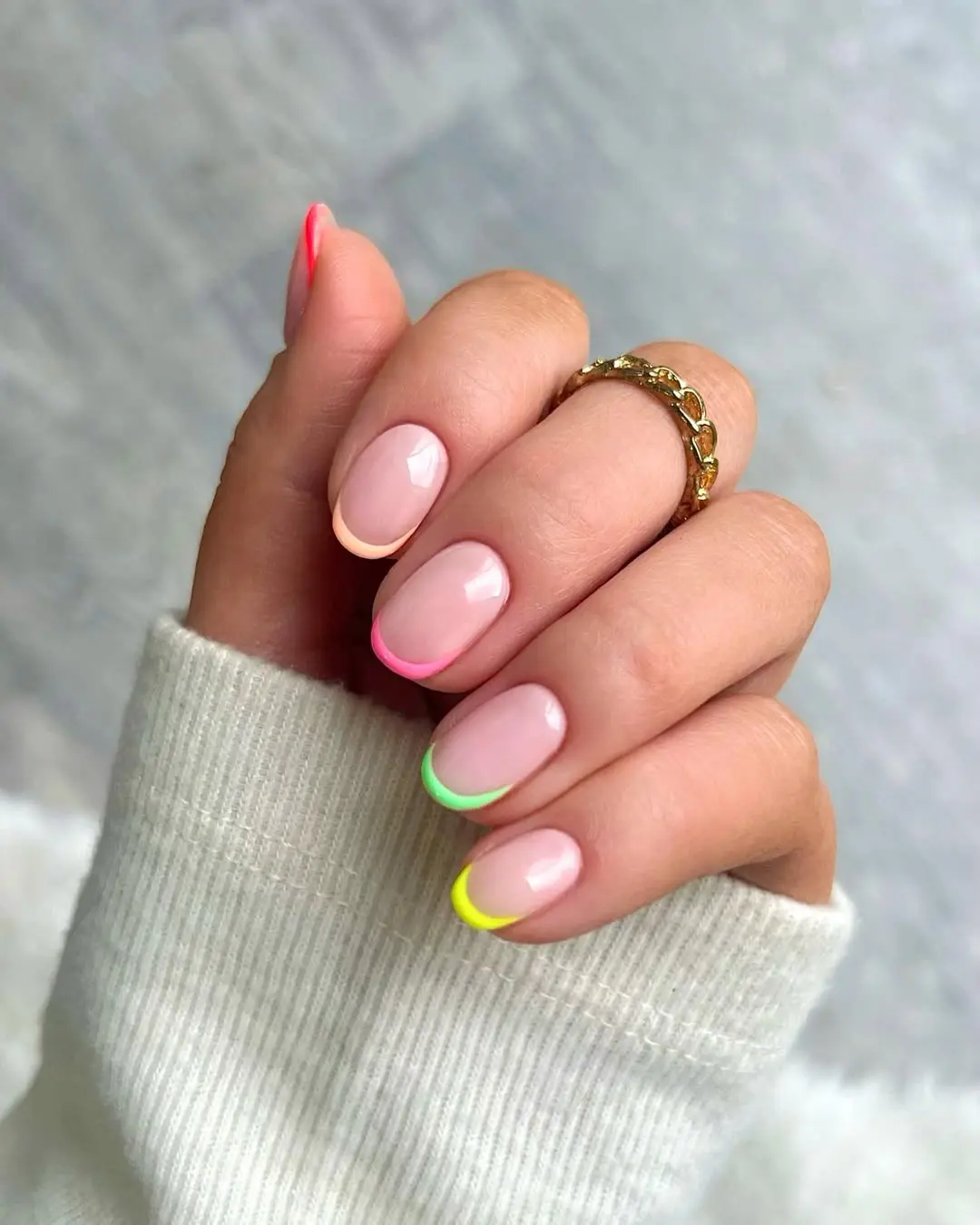 Neon tip nails on natural base, bright and bold accents.