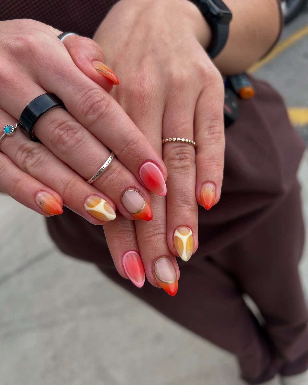 Fiery ombre nails with almond shape and warm tones
