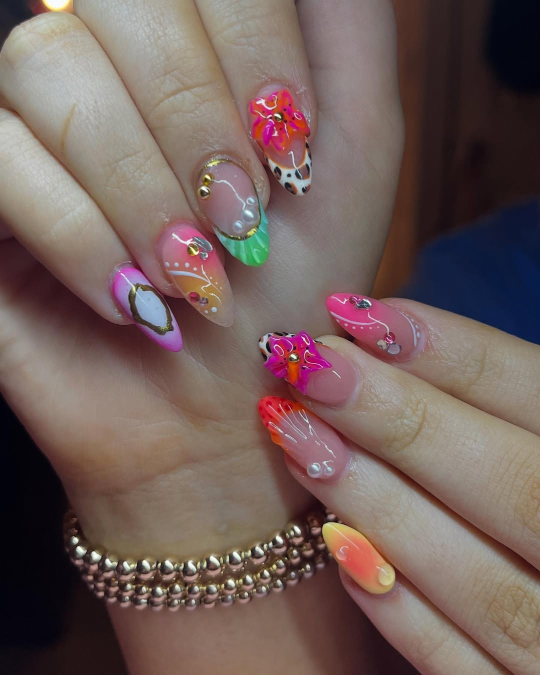 Eclectic art nails with stiletto shape and vibrant designs
