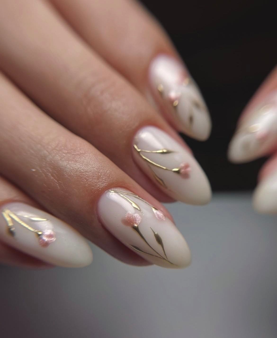 Minimalist blossom nails with almond shape and delicate accents