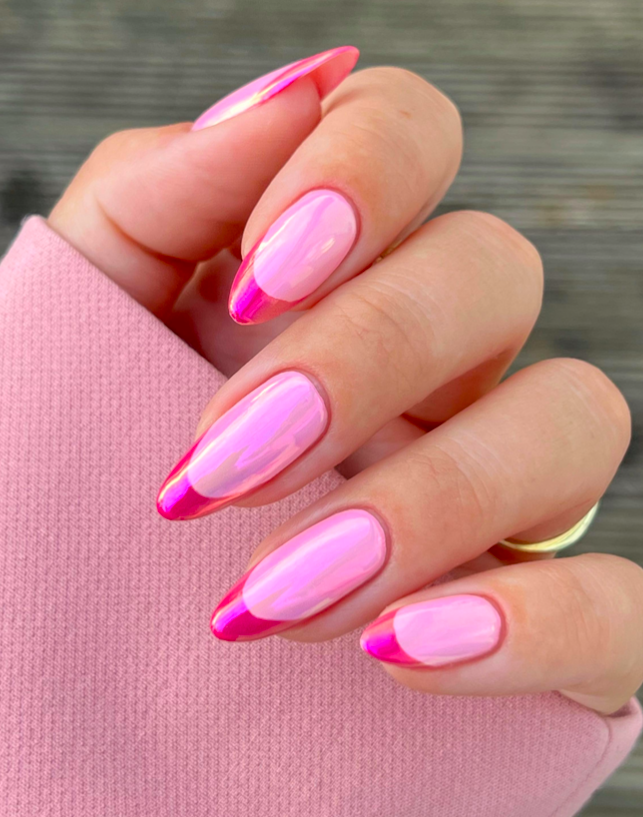Glossy pink French nails with almond shape and vibrant accents