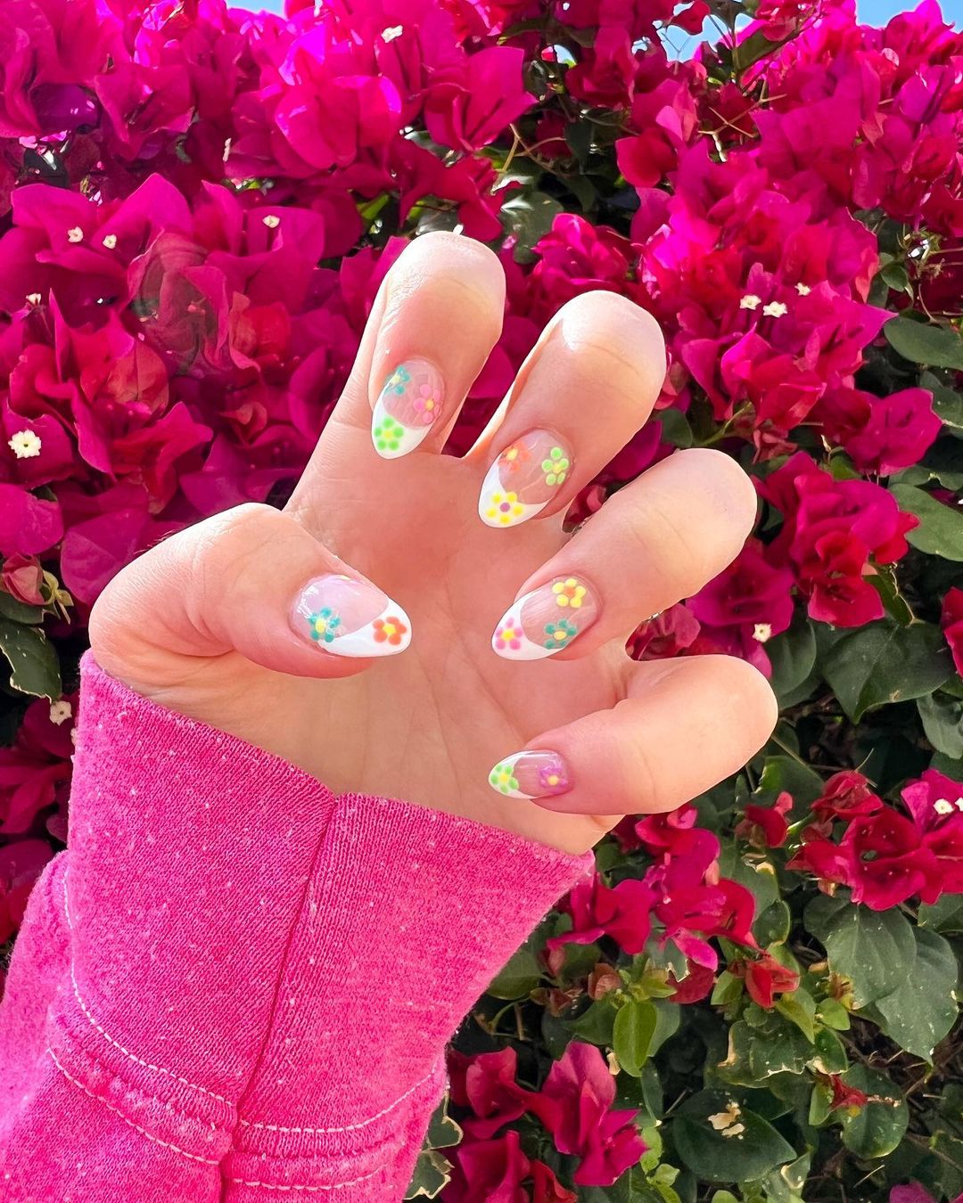 Floral nails with almond shape and colorful blooms