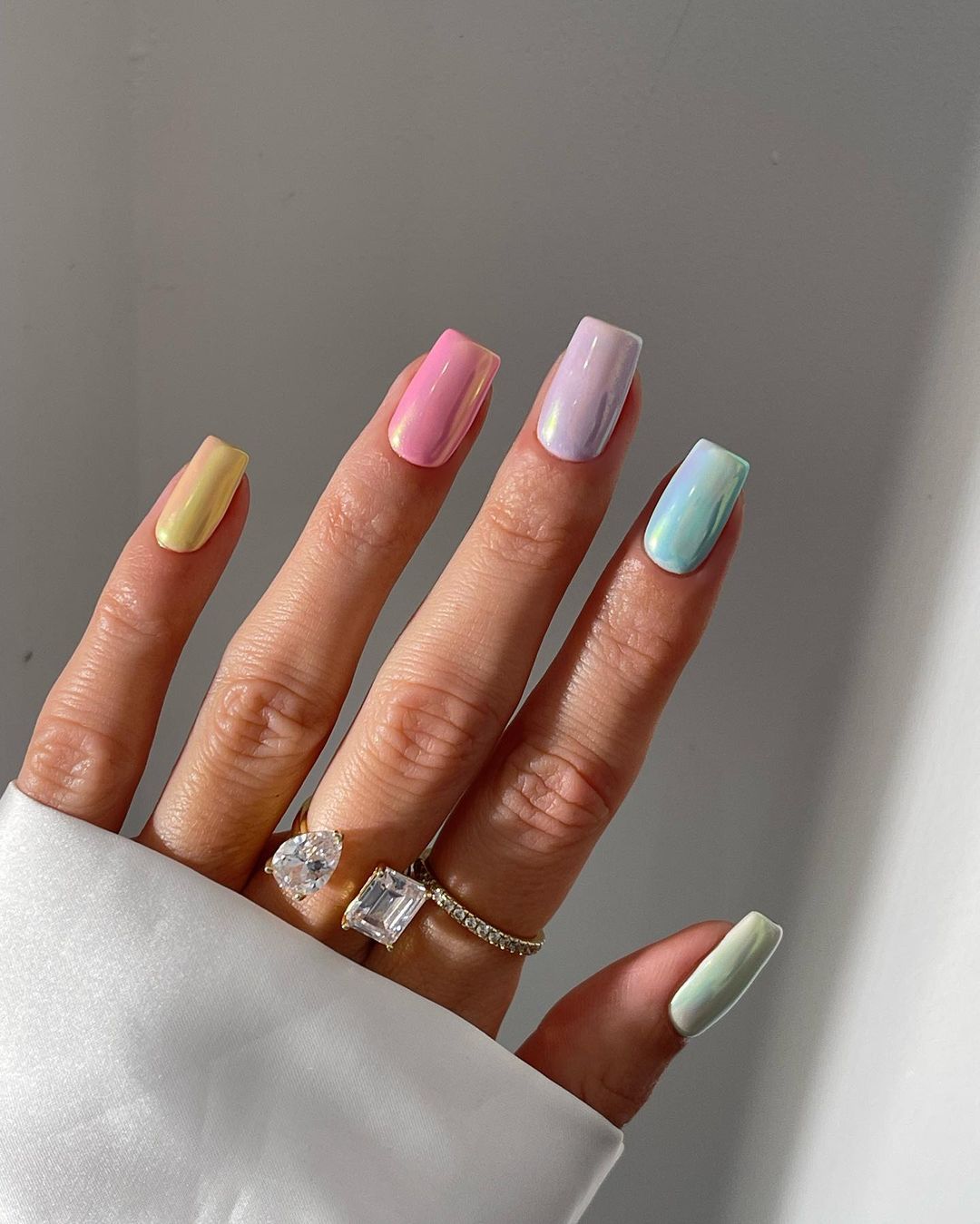 Pastel rainbow nails with square shape and glossy finish