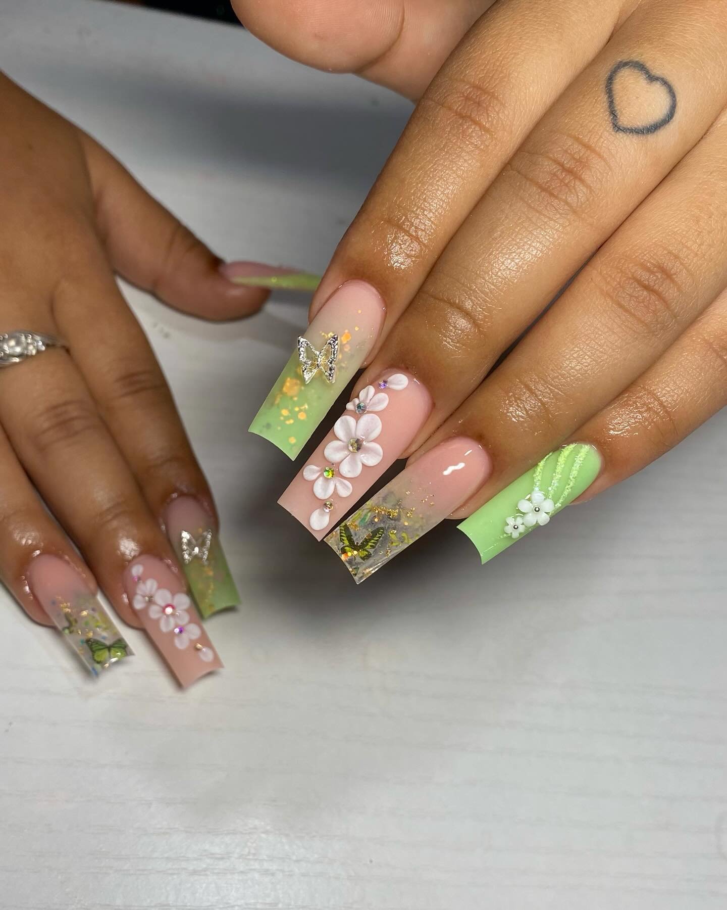 Green floral French tips on long square nails