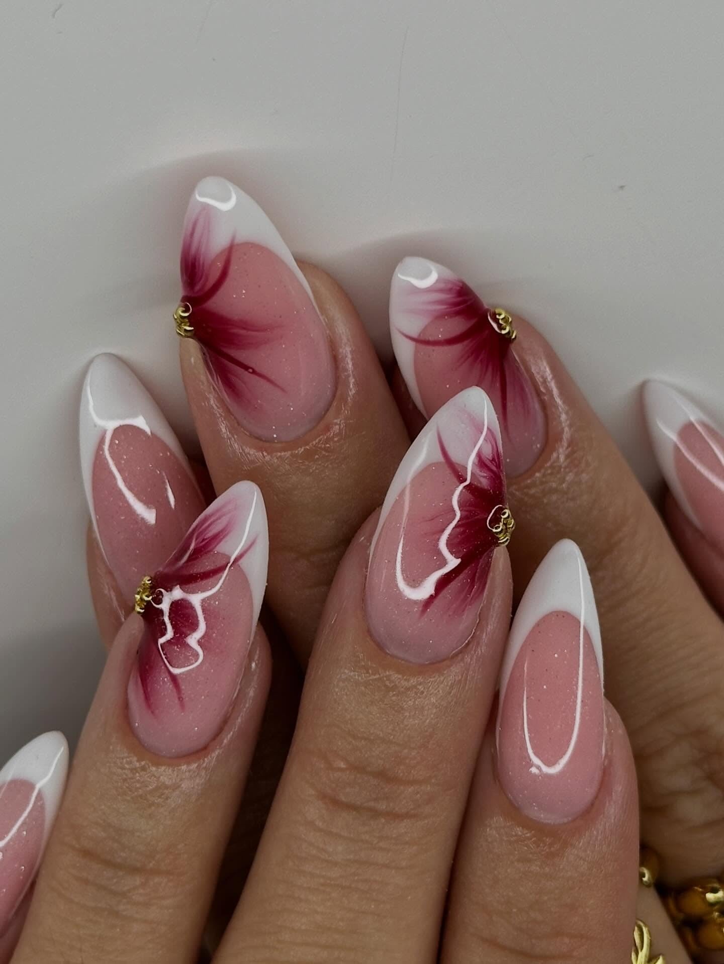 White and red floral French tips on almond nails