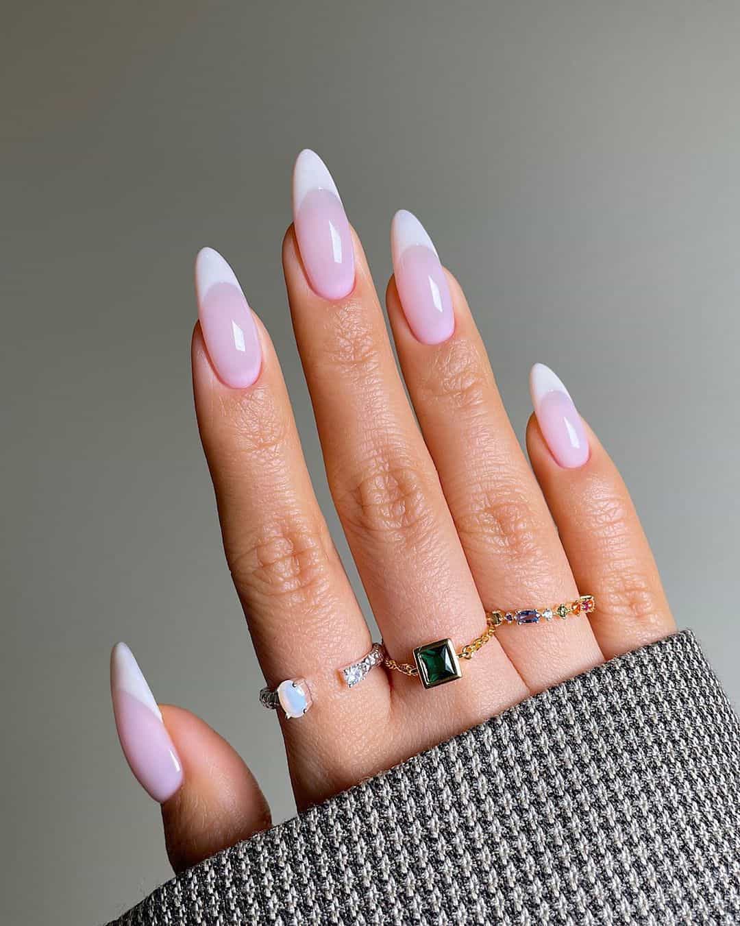 Soft pink French tips on almond nails