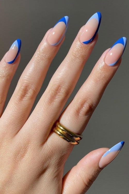 Geometric blue French tips on almond nails