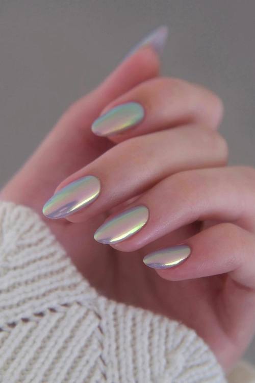 Holographic nails with a futuristic, shimmering effect, perfect for trendsetters.