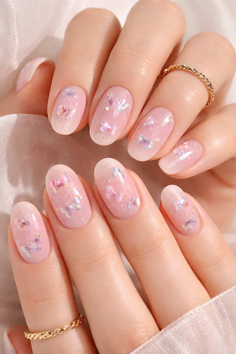 Delicate butterfly and glitter nails, evoking a dreamy and enchanting vibe.
