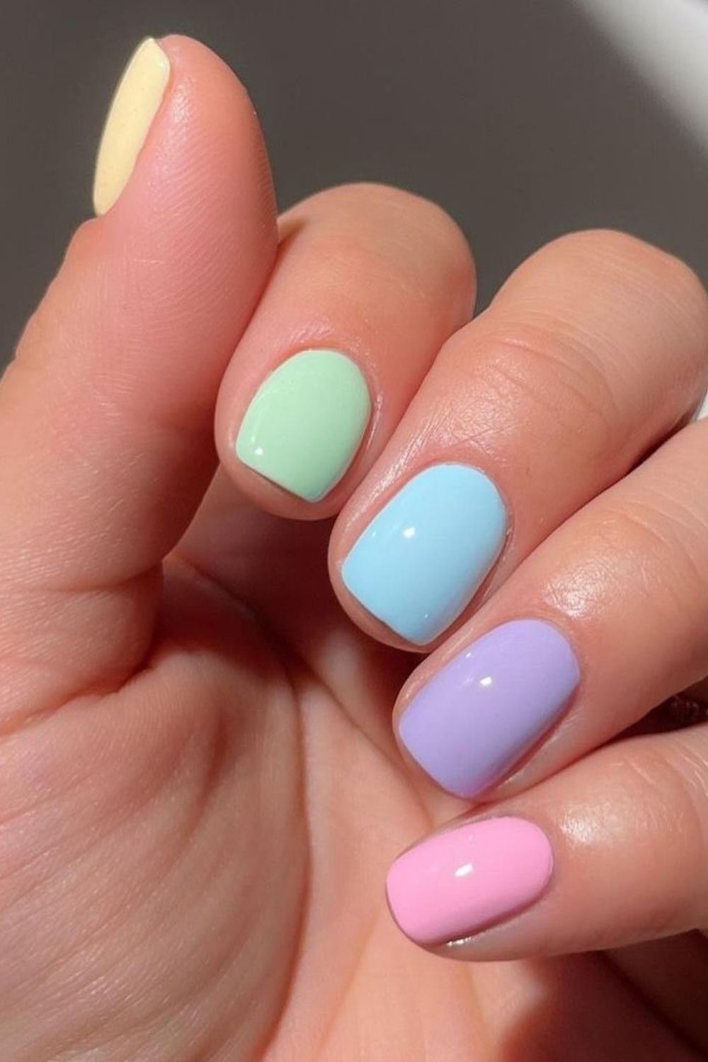 Pastel multicolor nails, playful and vibrant spring look.
