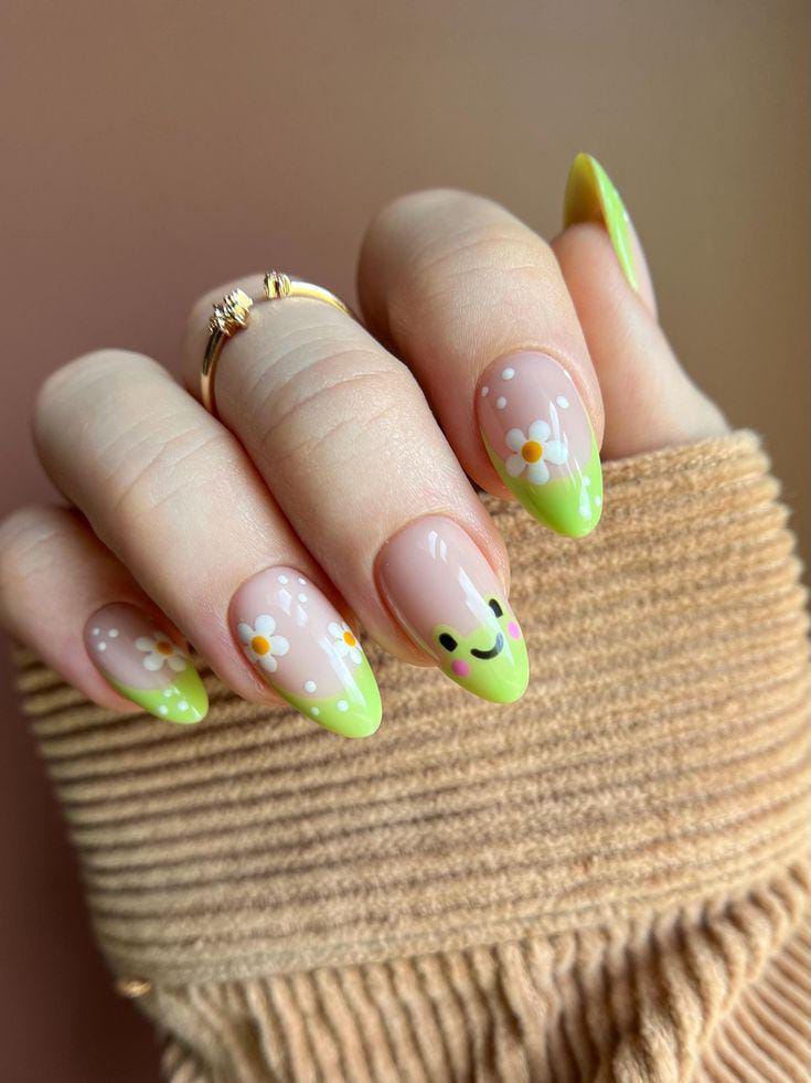 Green nails with daisy accents and smile.