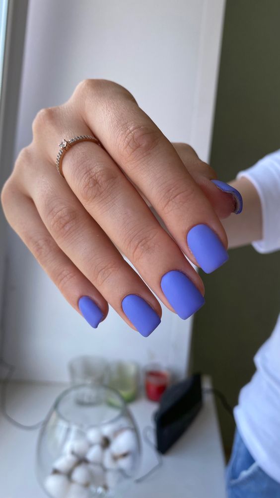 Matte lavender manicure on square nails.