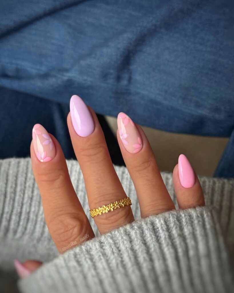 Pastel pink nail art on almond nails.