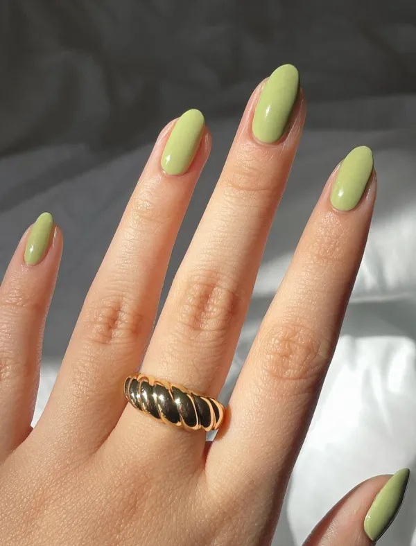 Olive green nails on almond shape.