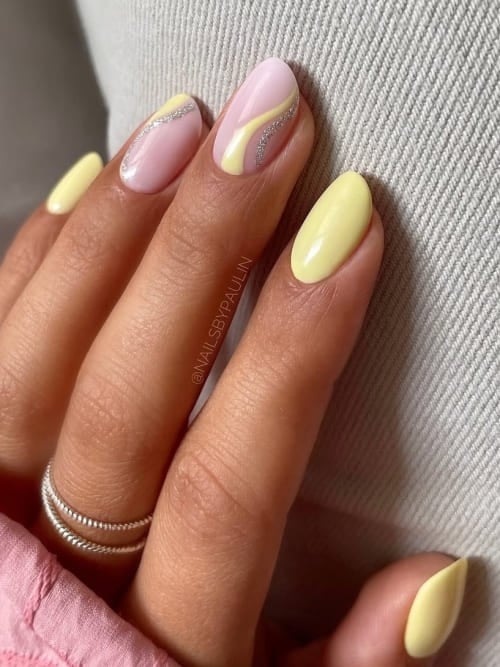 Yellow and pink almond nails with chrome accents, spring nail art, pastel manicure