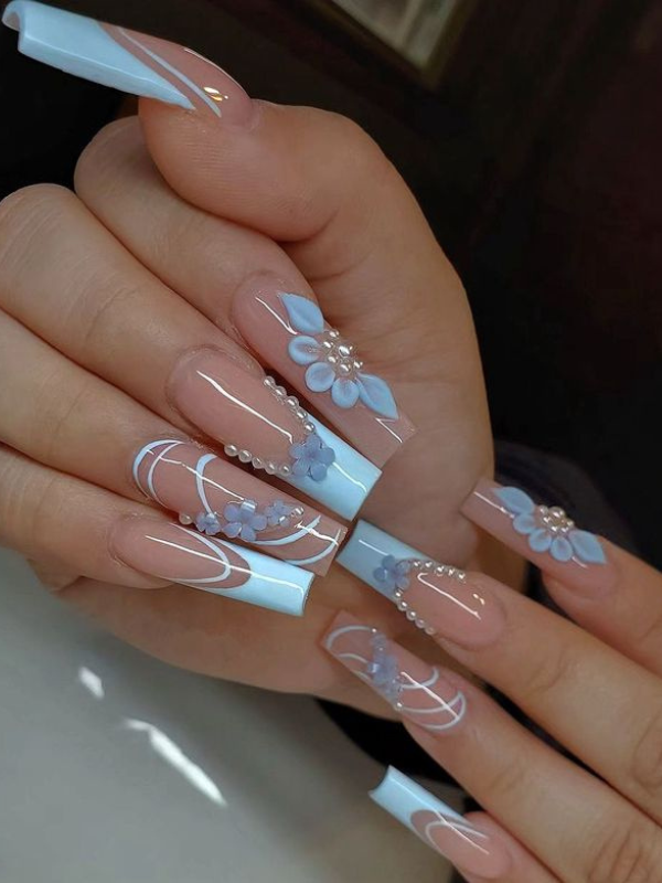 Sky blue nails with floral decorations, ornate spring nails, intricate design