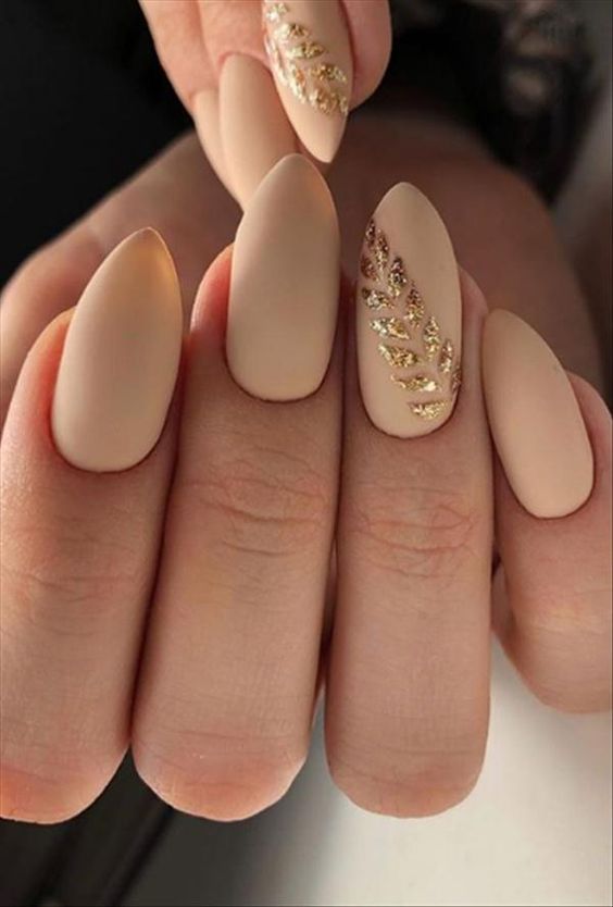 Matte nude nails with gold accents, elegant spring nails, chic nail design