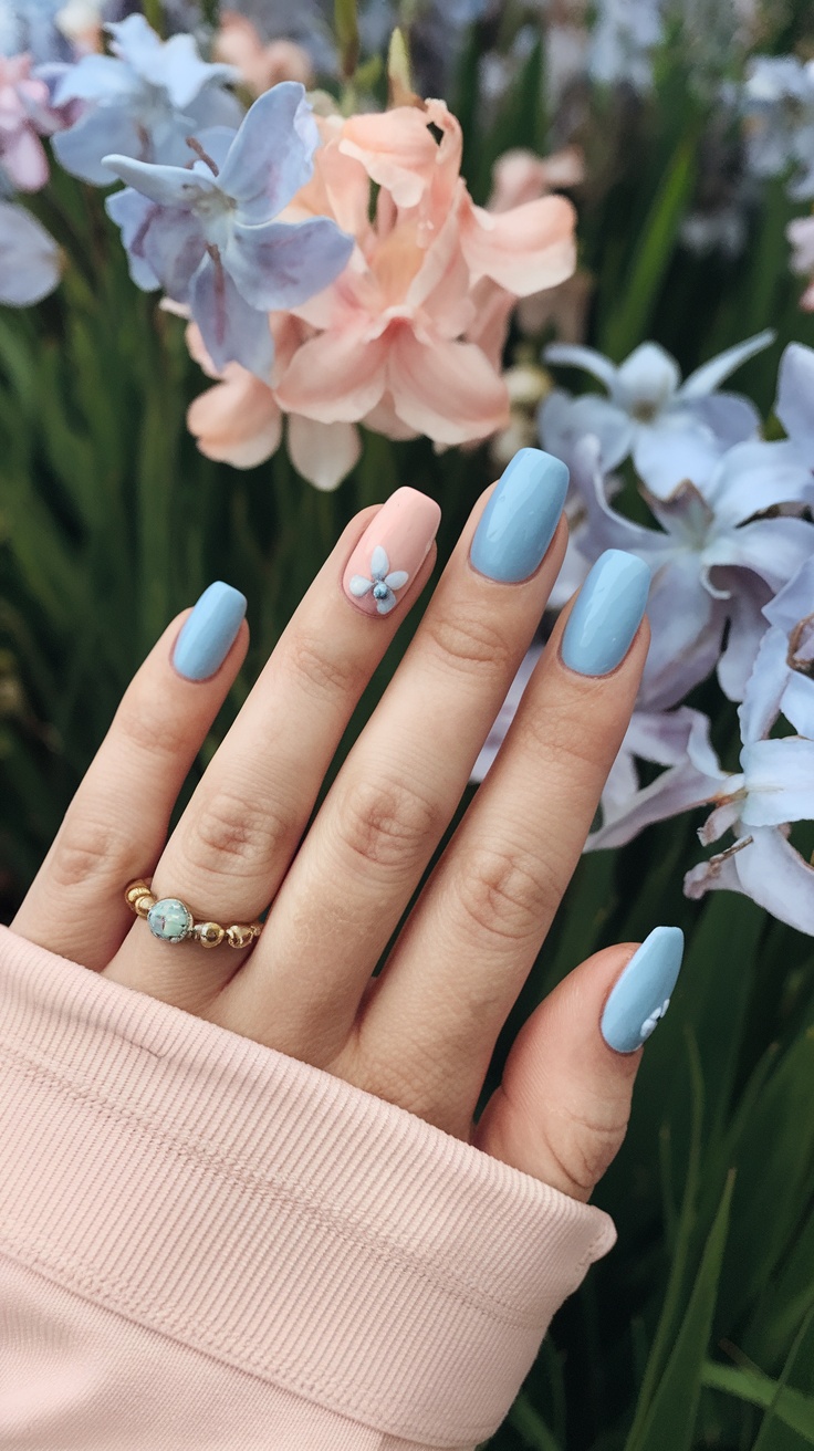 Blue square nails with floral accents, serene spring design, elegant nail art